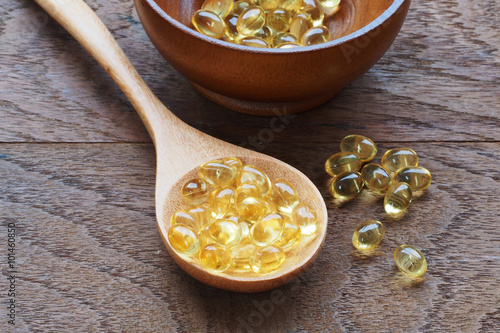 Fish oil capsules in a spoon
