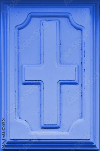 High resolution christian cross symbol in blue wooden background