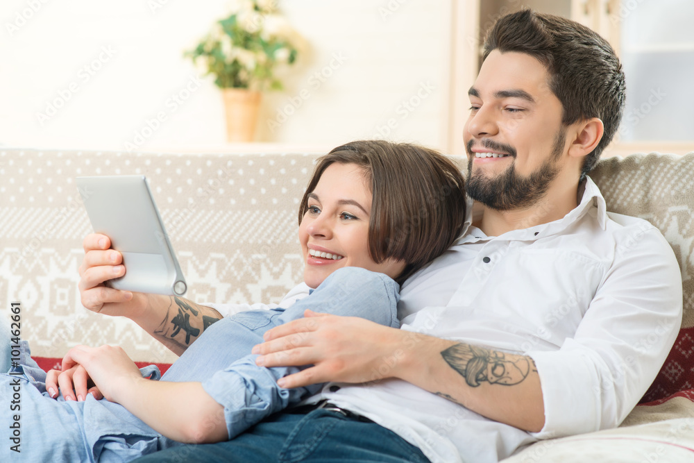 Loving couple sitting on the sofa Loving couple sitting on the sofa