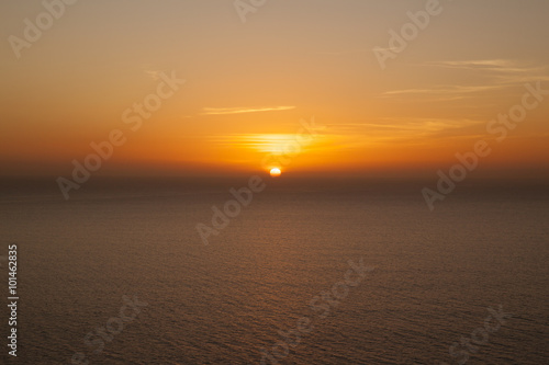 Sunset over North Atlantic Ocean. Taken at Purto Rico, Gran Canaria Island, Spain. photo