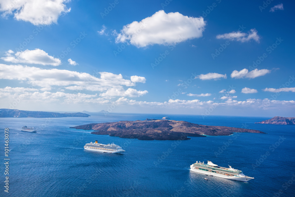 Ships against Volcano on Santorini island in Greece