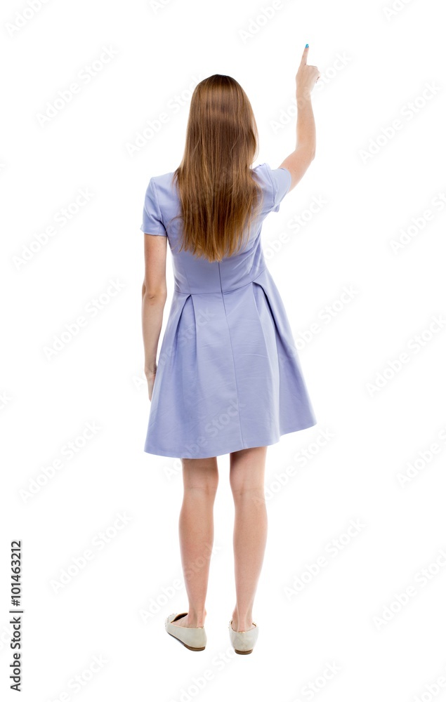 Back view of pointing woman. Back view of pointing woman.