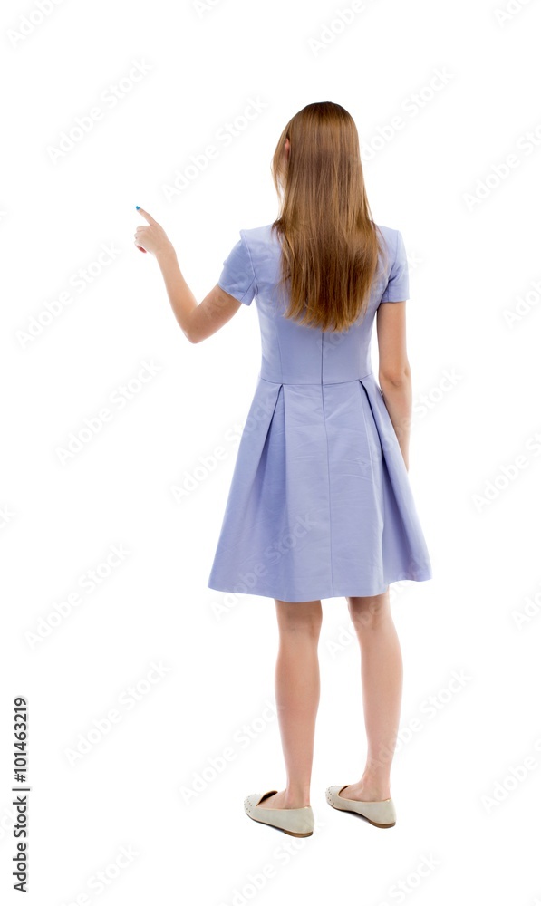 back view of young woman presses down on something. back view of young woman presses down on something.