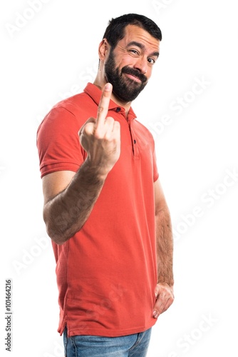 Handsome man making horn gesture © luismolinero