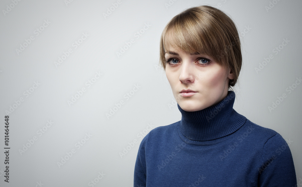 Beautiful sad girl with big blue eyes looking into the camera. P Beautiful sad girl with big blue eyes looking into the camera. P