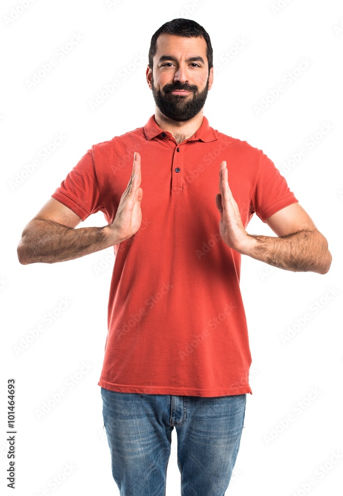 Fototapeta premium Handsome man holding something
