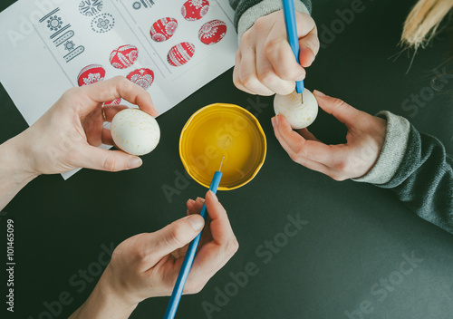 Decorating an Easter egg with wax