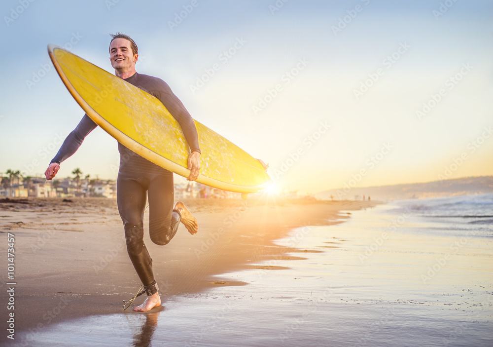 Surfer running on the beach Stock Photo | Adobe Stock