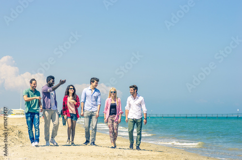 Friends walking on the beach