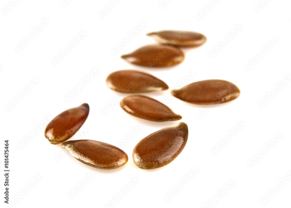 Close up of flax seeds isolated on white background Close up of flax seeds isolated on white background
