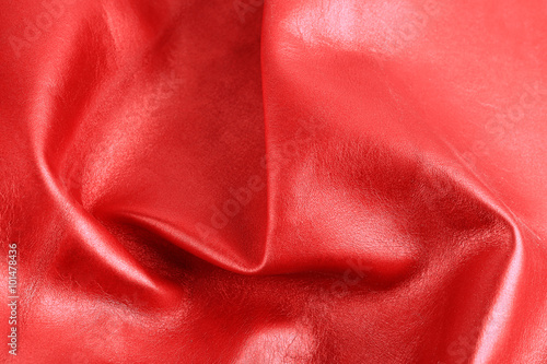 Red shiny leather texture close up
