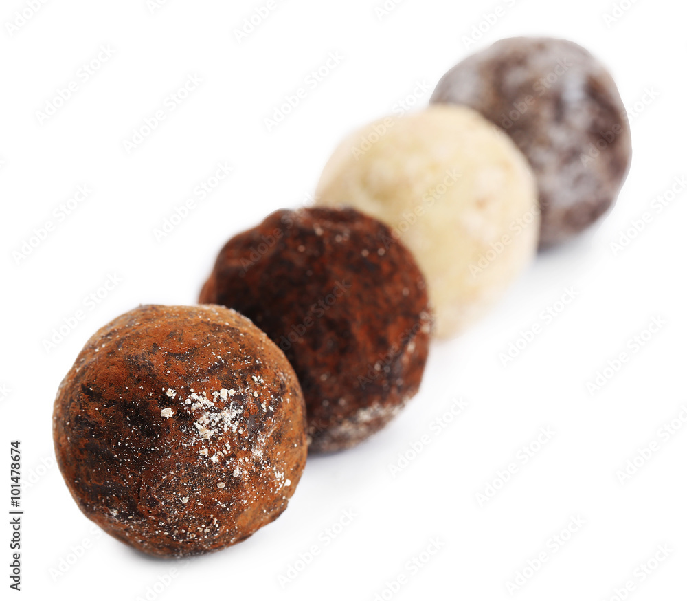 Row of chocolate truffles, isolated on white Row of chocolate truffles, isolated on white