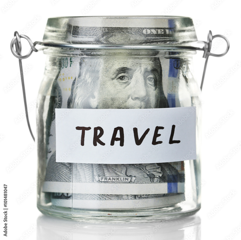 Glass jar with dollar banknotes for travel, isolated on white Glass jar with dollar banknotes for travel, isolated on white