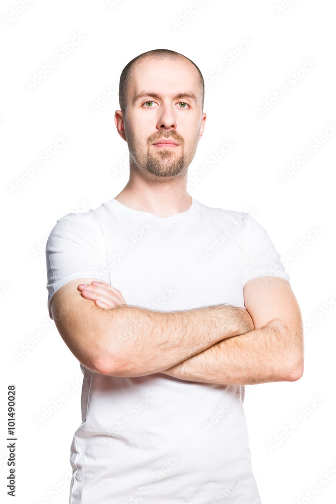 Portrait of a confident bald bearded man in white t-shirt isolated on white Portrait of a confident bald bearded man in white t-shirt isolated on white
