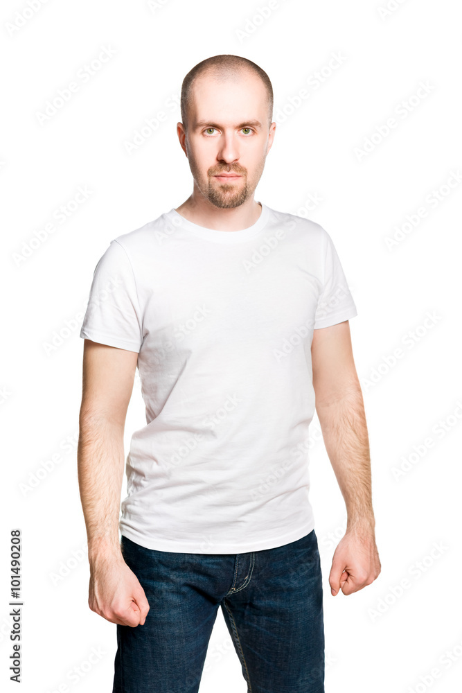 Attractive bald bearded man with clenched fists in white t-shirt and jeans isolated on white Attractive bald bearded man with clenched fists in white t-shirt and jeans isolated on white