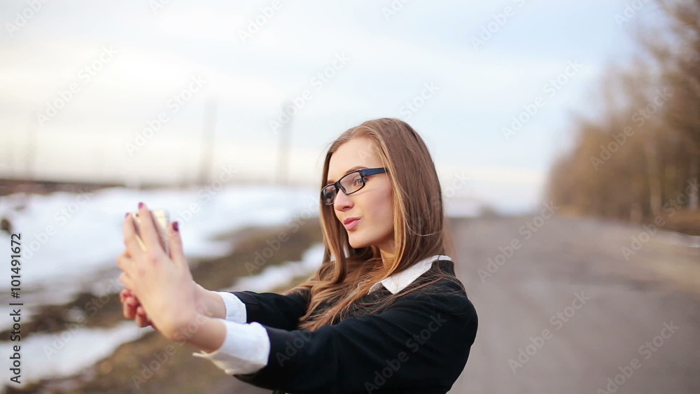 girl preens doing selfie using front facing camera of the smartphone girl preens doing selfie using front facing camera of the smartphone