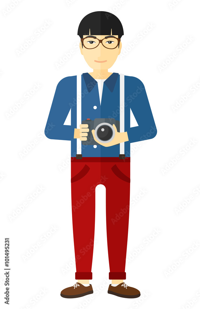 Smiling photographer holding camera. Smiling photographer holding camera.