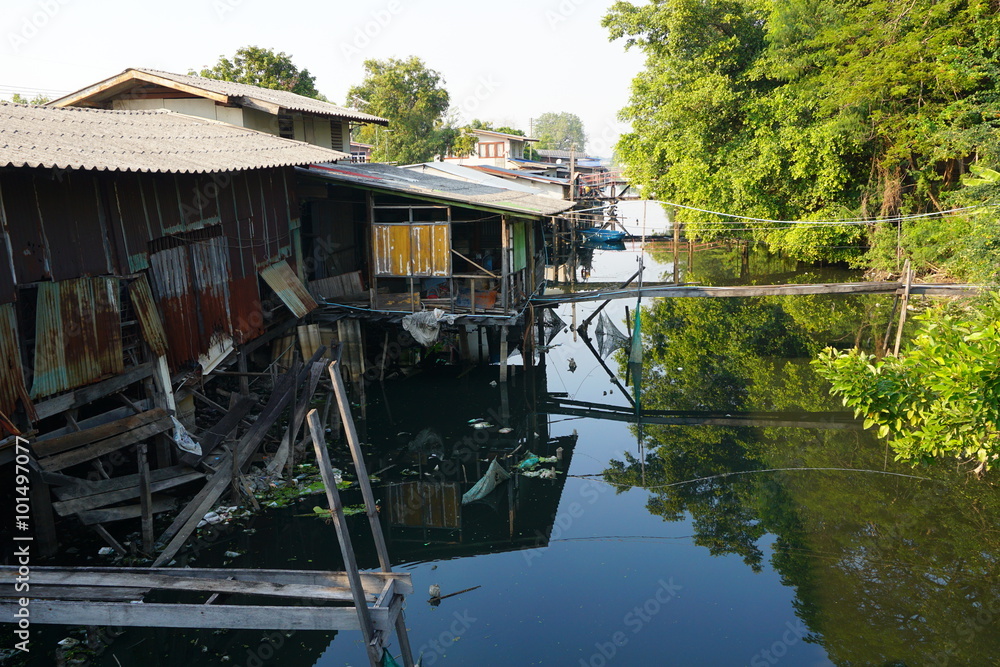 House on stilts. Views of the city's Slums from the river in Bangkok, Thailand.