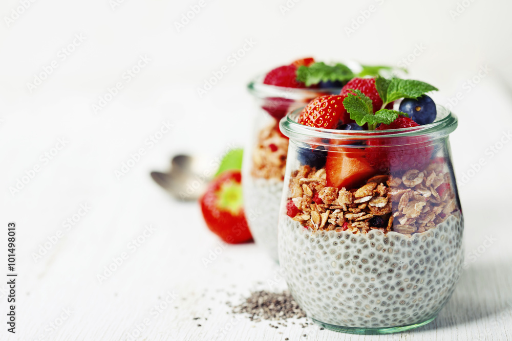 Сhia seeds vanilla pudding and berries on wooden rustic backgr Сhia seeds vanilla pudding and berries on wooden rustic backgr