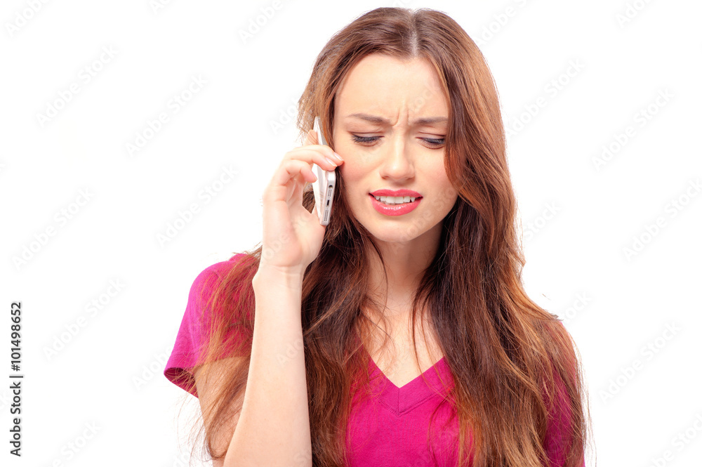 Stressed, tired and worried young woman talking on the phone iso Stressed, tired and worried young woman talking on the phone iso