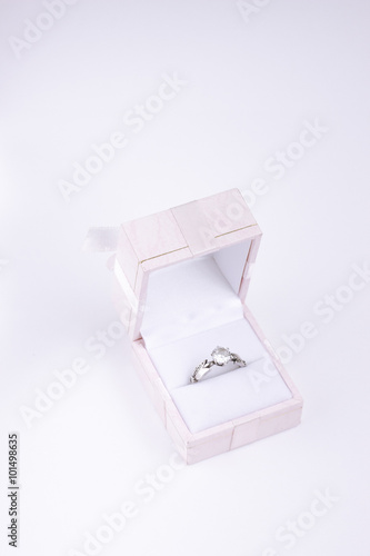 Diamond silver engagement ring in pink box isolated
