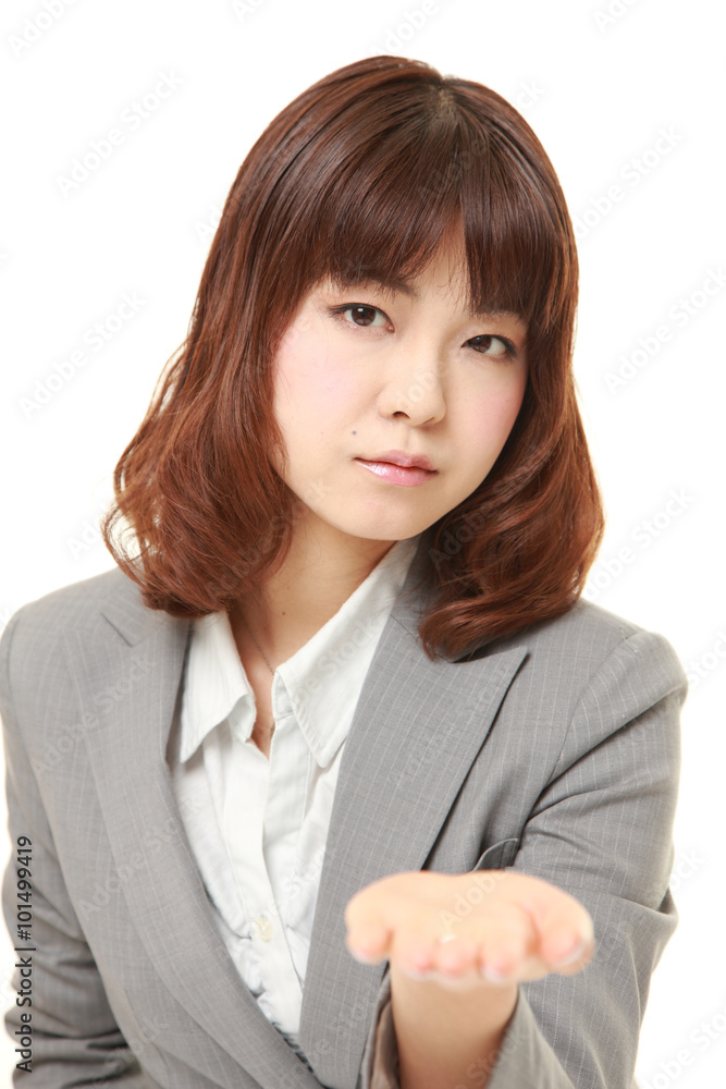 young Japanese angry businesswoman requests something young Japanese angry businesswoman requests something