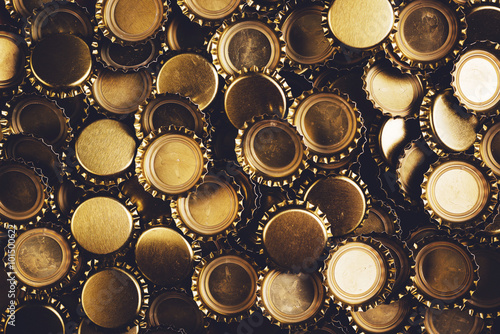Beer bottle caps heap as background
