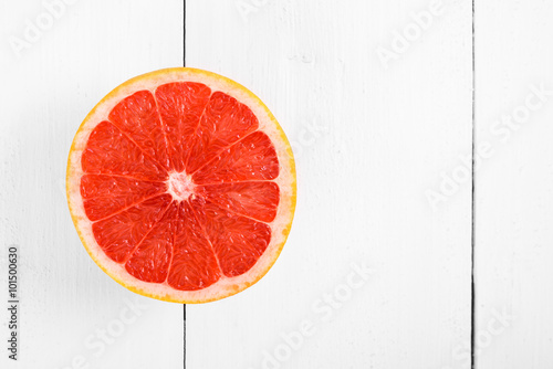 Fresh Red Grapefruit Slice On White Table