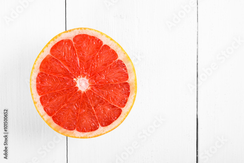 Fresh Red Grapefruit Slice On White Table