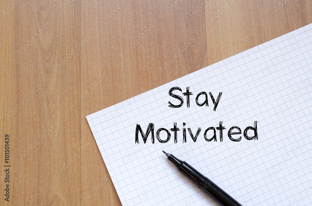 Stay motivated write on notebook Stay motivated write on notebook
