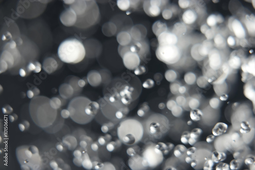 Abstract blurred levitating water drops