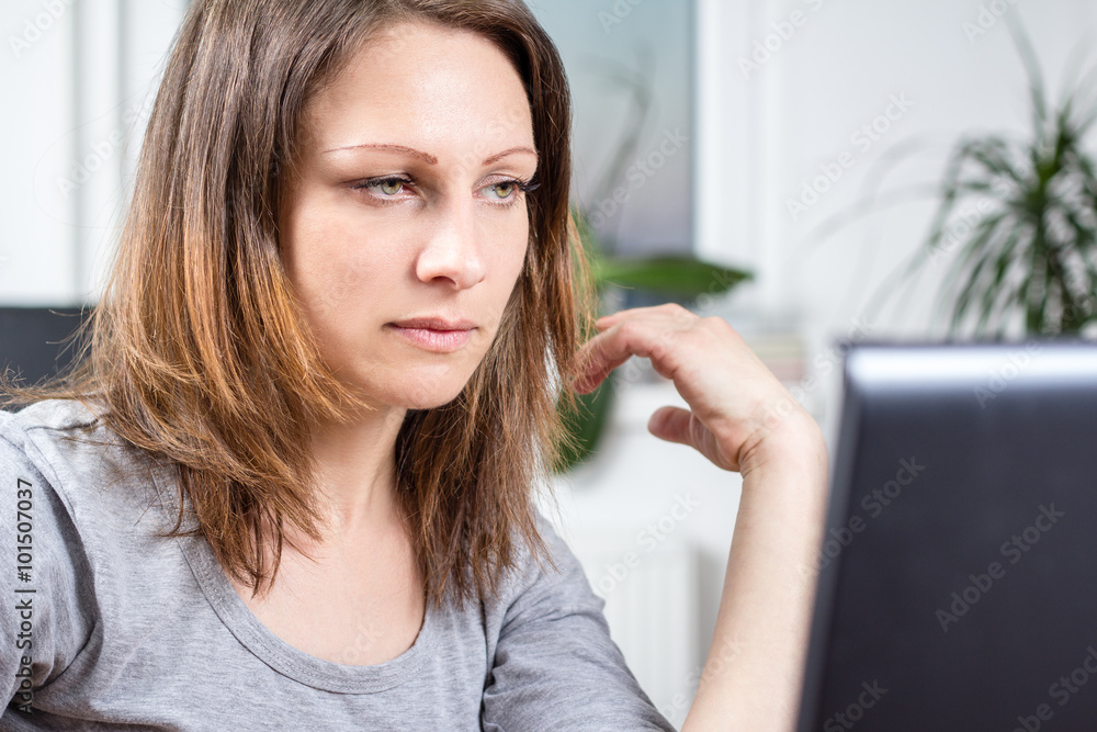 Photo of young woman working on laptop Photo of young woman working on laptop