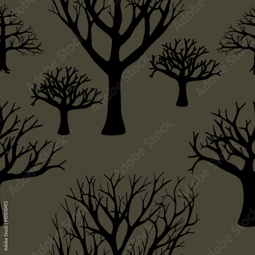 Seamless background of silhouettes of trees. © snesivan