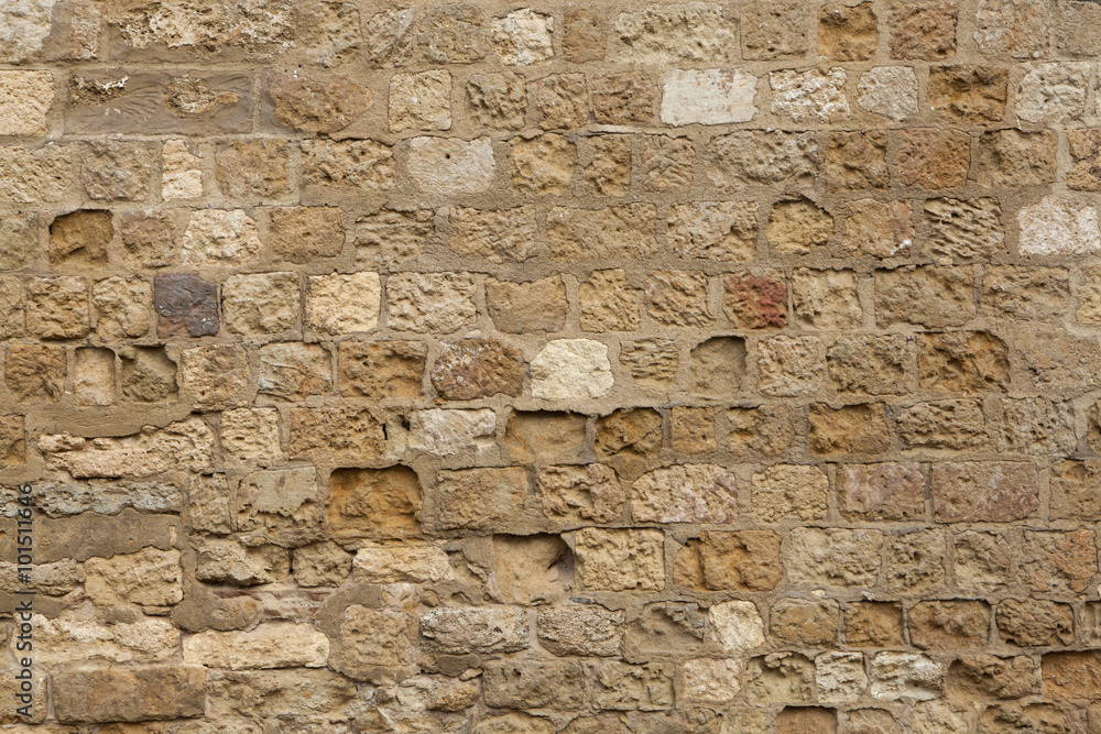 Medieval stone wall in Cordoba, Andalusia, Spain. Background tex Medieval stone wall in Cordoba, Andalusia, Spain. Background tex