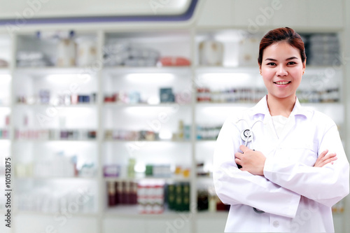 pharmacist chemist and medical doctor woman asia with stethoscope and clipboard checking medicine cabinet and pharmacy drugstore .