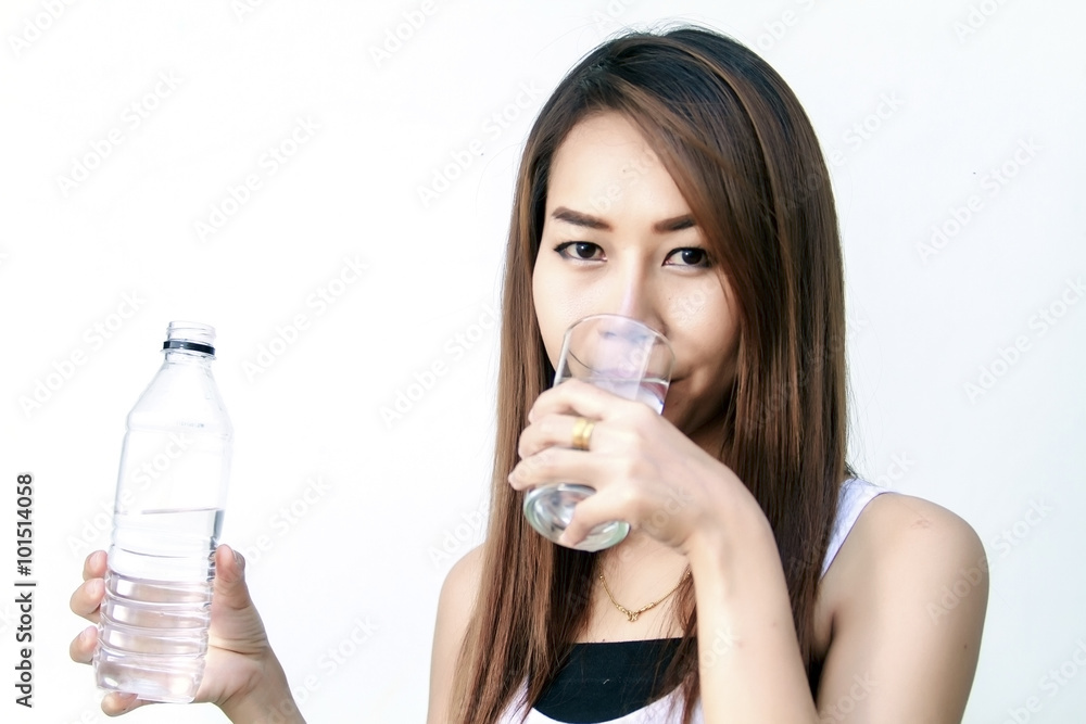 Portrait of young beautiful woman asia drinking water at summer and holding bottle Portrait of young beautiful woman asia drinking water at summer and holding bottle