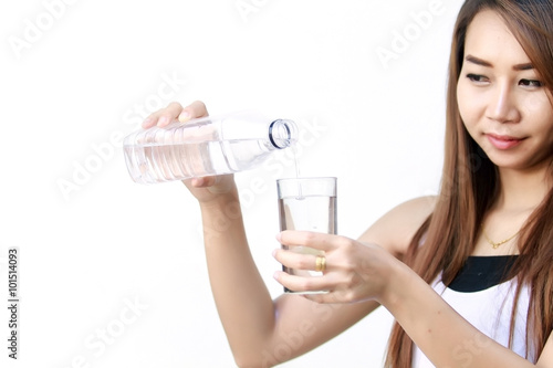Portrait of young beautiful woman asia drinking water at summer and holding bottle