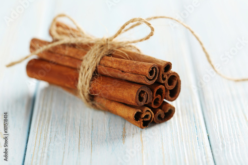 Cinnamon on a blue wooden background
