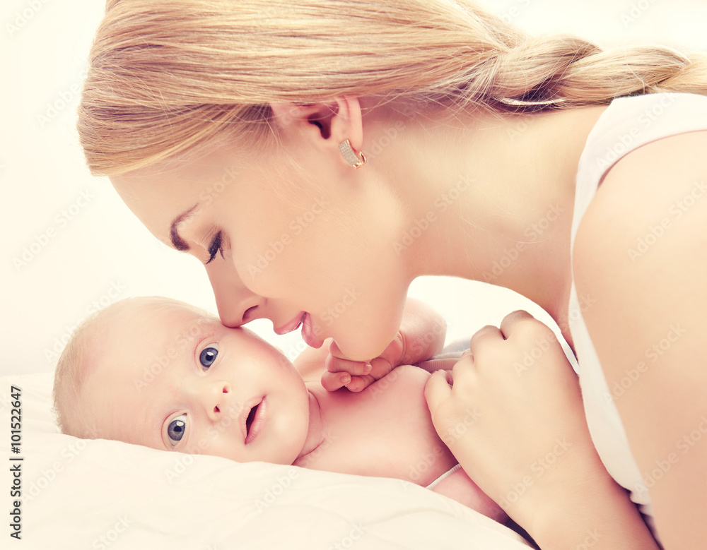 Portrait happy mother and baby . Smiling Woman with her newborn baby Portrait happy mother and baby . Smiling Woman with her newborn baby