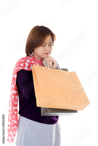 Woman holding few shopping bags photo