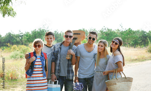 A group of joyful friends h...