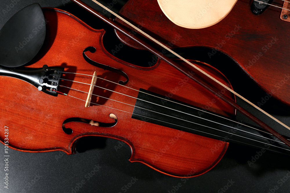 Electric guitar and violin on grey background Electric guitar and violin on grey background