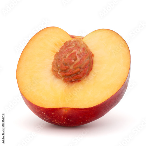 Nectarine fruit half isolated on white background close up