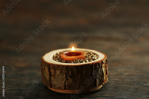 Burning wooden candle with sea salt, closeup