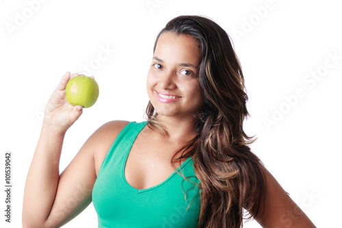 Beautiful Latin woman holding an apple on white background