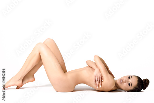 Fotografía Young fit naked girl with healthy clean skin lying down