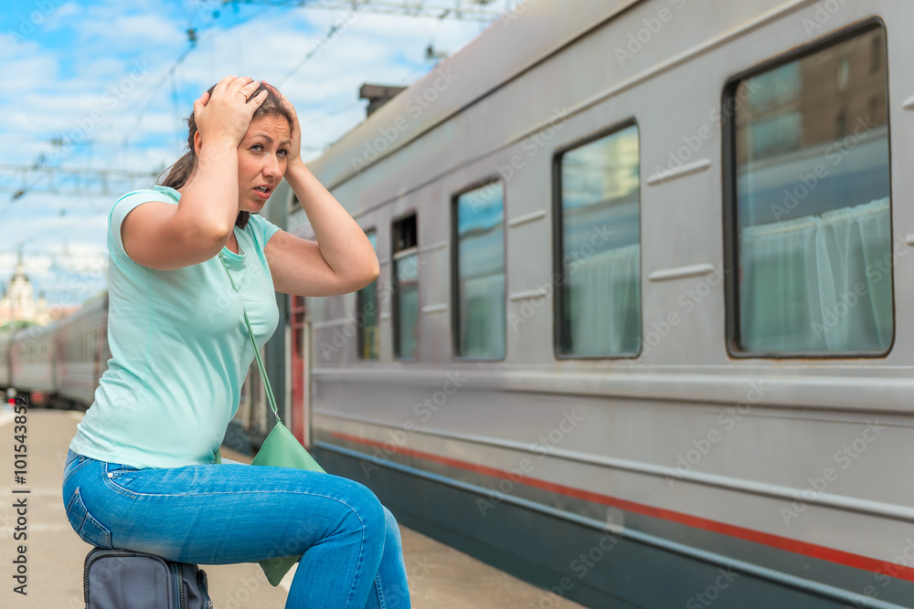 emotional woman looks at the departing train on which she was la emotional woman looks at the departing train on which she was la