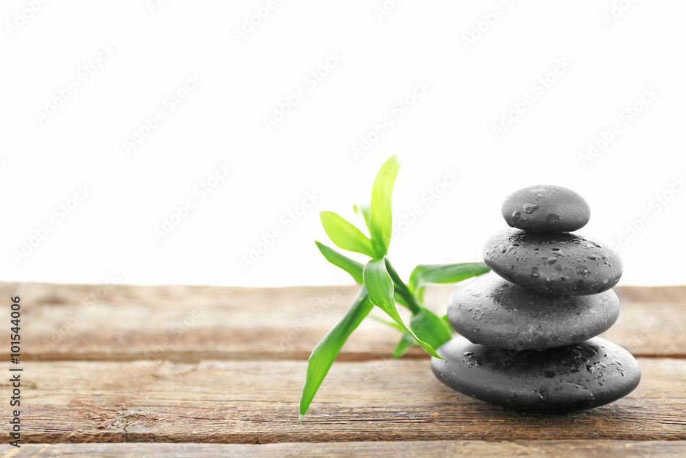 Spa stones with bamboo on white background Spa stones with bamboo on white background