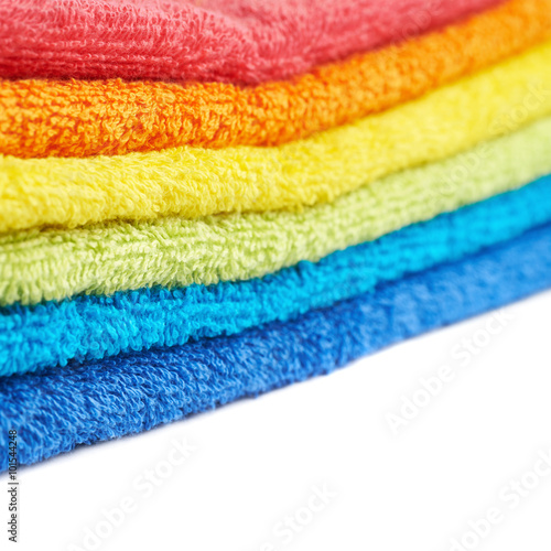Rainbow colored pile of towels isolated