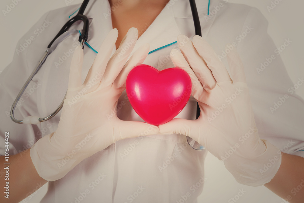 The doctor shows heart isolated on a white background The doctor shows heart isolated on a white background